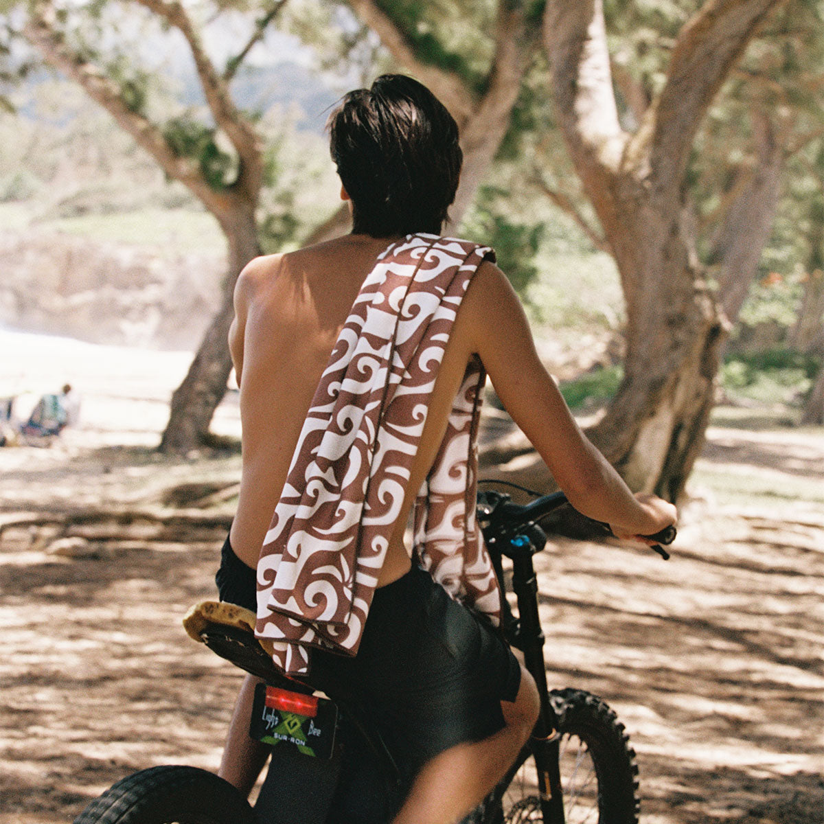 Sand-resistant towel with textured fabric, shown outdoors.