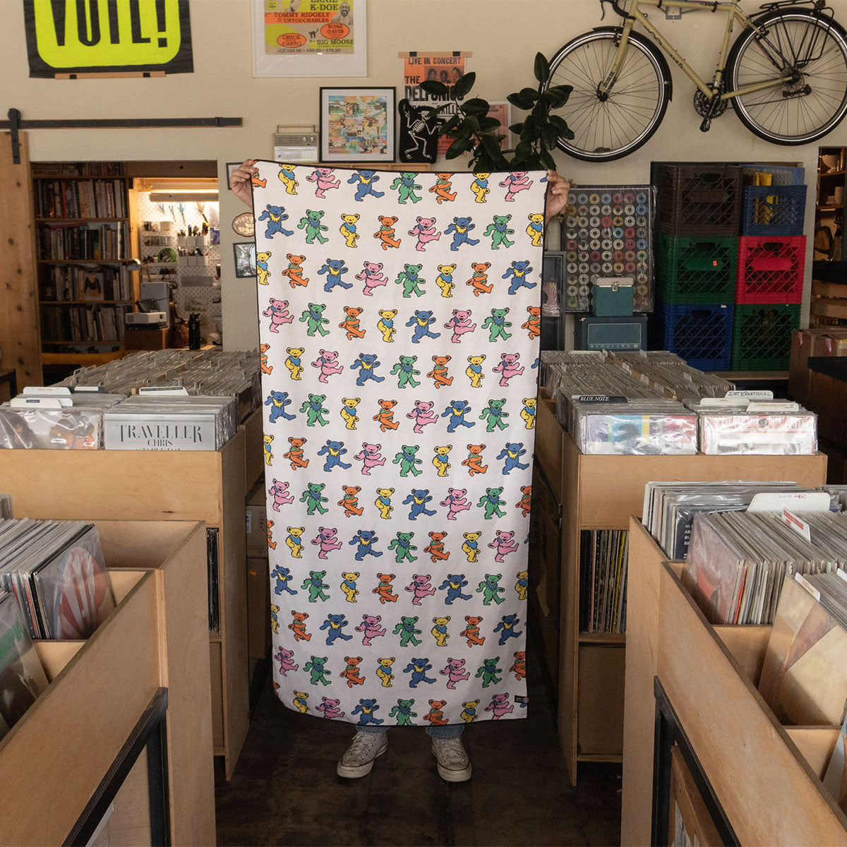 Quick-dry towel made from recycled materials with colorful dancing bears pattern.
