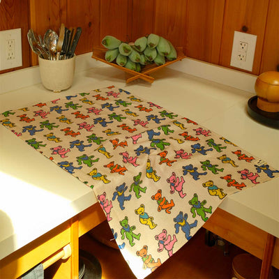 Quick-dry kitchen towel featuring a colorful Dancing Bears pattern on a countertop.