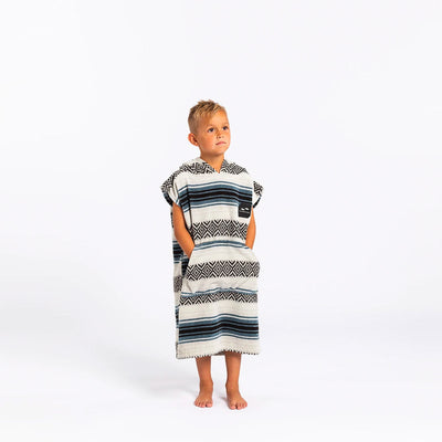 Kids hooded poncho in cotton terry with blue and black tribal stripes and a pocket.