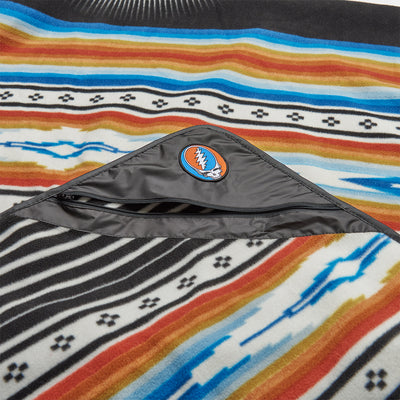 Outdoor blanket, recycled material, colorful stripes, pocket, skull logo patch.