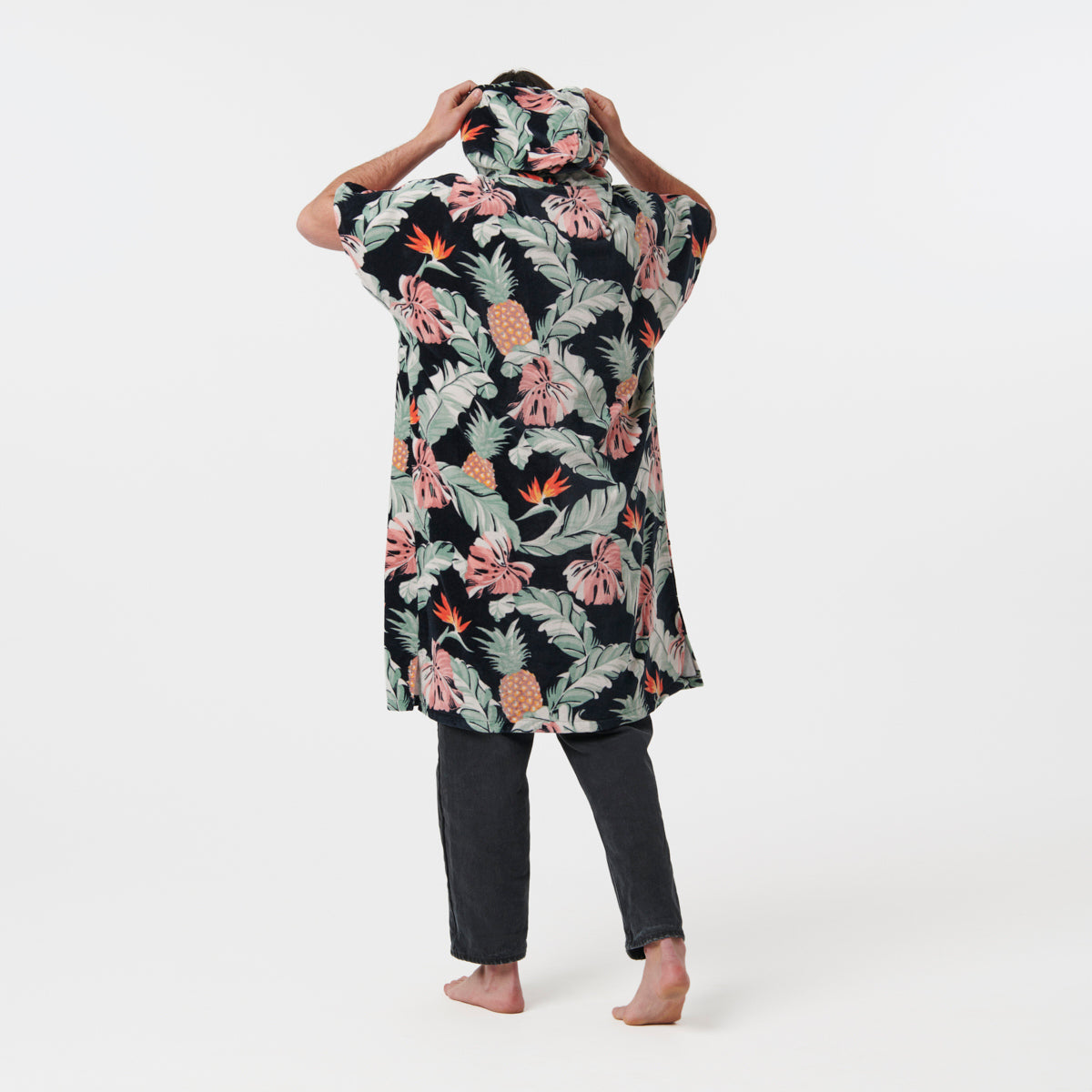 Floral winter-weight cotton changing poncho with black pants.