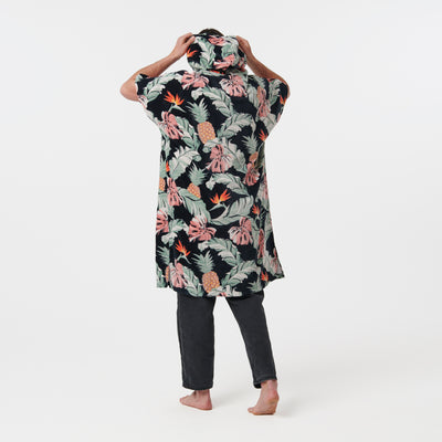 Floral winter-weight cotton changing poncho with black pants.