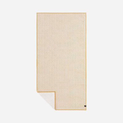 Cotton towel with orange and white checkered pattern, folded corner visible.