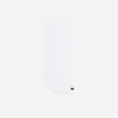 White textured spa towel, 500 GSM cotton, with small black label.